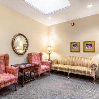 Cozy waiting room with stylish furniture and decor.