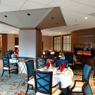 A well-decorated restaurant dining area with set tables and chairs.