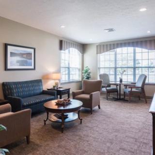 Cozy living room with comfortable seating and large windows