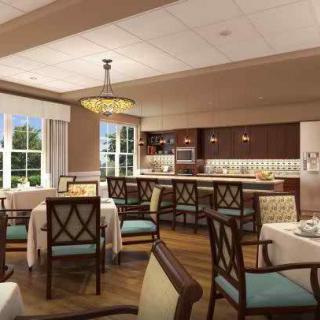 Elegant dining area with stylish furnishings and a modern chandelier.