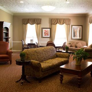 A cozy living room with comfortable seating and elegant decor.