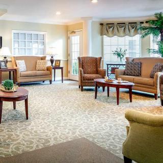 A cozy living room with comfortable seating and natural lighting.