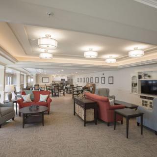 A spacious and elegantly designed lounge area with comfortable seating and ambient lighting.