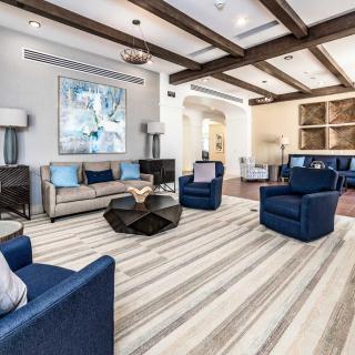 A modern living room with stylish furnishings and artwork.