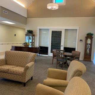 A cozy and inviting lobby area featuring comfortable seating and a warm ambiance.