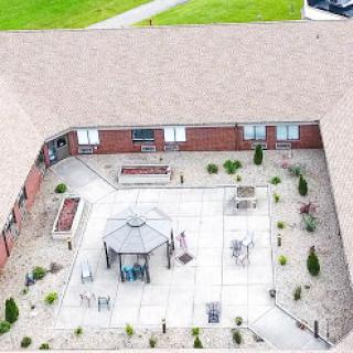 Aerial view of a well-designed courtyard featuring a gazebo, seating areas, and landscaped surroundings.