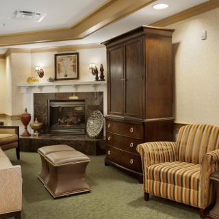 A cozy living room with traditional furniture and a fireplace.