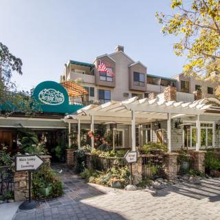 A charming restaurant with outdoor seating on a sunny day.