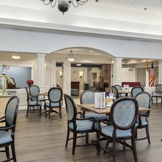 An elegant dining area designed for a senior community, featuring comfortable seating and a welcoming atmosphere.