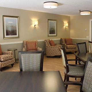 A cozy lounge area featuring comfortable seating and warm lighting.