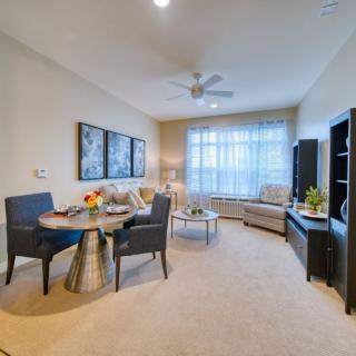 A cozy living room with a dining area and tasteful decor.