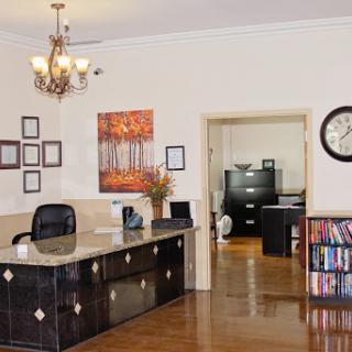 A welcoming office reception area featuring elegant decor and functional workspace.