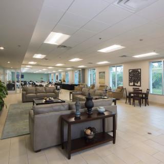 A modern and spacious lobby area with comfortable seating and bright lighting.