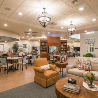 A cozy and modern living area with comfortable seating and warm lighting.