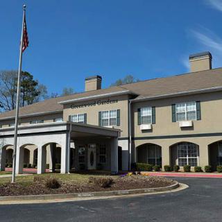 Exterior view of a hotel building with an American flag.