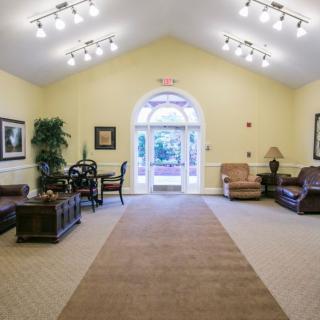 A well-lit lobby area with comfortable seating and decor.