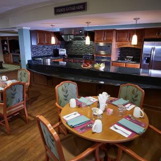 A cozy kitchen and dining area with a set table and modern appliances.