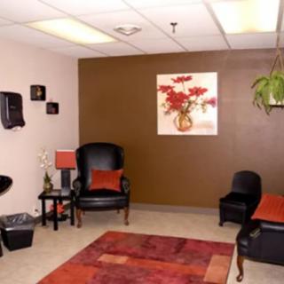 A cozy waiting room with comfortable seating and warm decor.