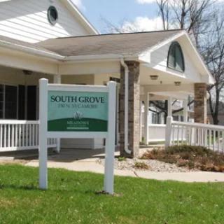 A business building with a sign reading 'South Grove - Professional Park'.