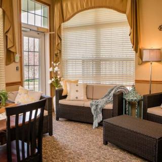 A cozy living room with elegant furniture and decor.
