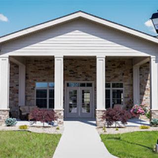 A welcoming residential building with a spacious front entrance and well-maintained landscaping.