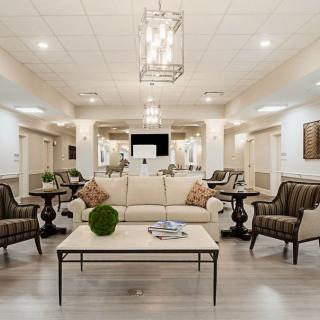 A modern and elegant living room with stylish furniture and sophisticated lighting.