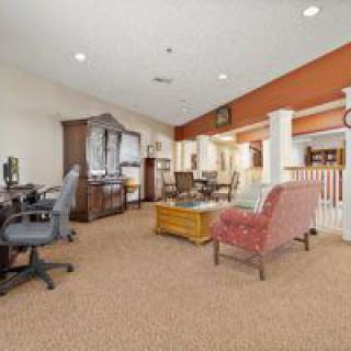A cozy living room with traditional decor and comfortable seating.