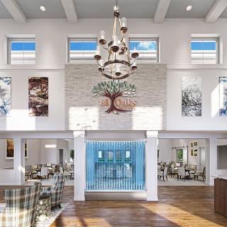 A spacious and modern interior featuring a large chandelier, multiple windows, and decorative artwork on the walls.