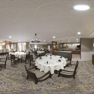 A modern dining area featuring elegantly arranged round tables and stylish chairs.