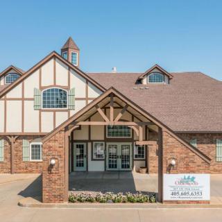 The exterior of a Tudor-style clinic building with a prominent entrance.