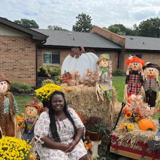 Celebrating the beauty of autumn with festive decorations and cheerful scarecrows.
