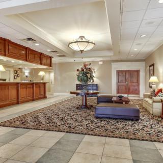 A spacious hotel lobby with elegant furnishings and a welcoming atmosphere.