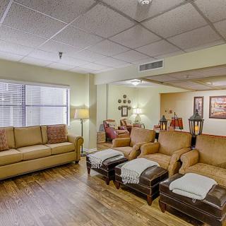 A cozy living room with comfortable seating and warm decor.