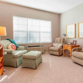 A cozy living room with comfortable seating and natural light.
