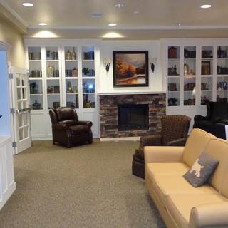 Cozy living room with a fireplace and built-in bookshelves.
