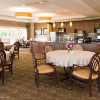 An elegant dining area with neatly arranged tables and chairs, offering a cozy and inviting atmosphere.