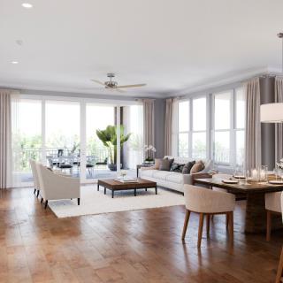 A bright and spacious living room with modern furnishings and large windows allowing plenty of natural light.