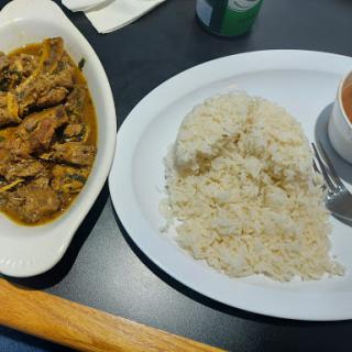 A delicious serving of curry with rice, perfect for a hearty meal.