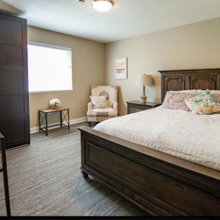 Cozy and well-furnished bedroom with natural light.