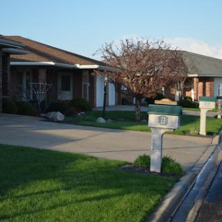 A serene residential neighborhood featuring well-maintained homes and mailboxes.