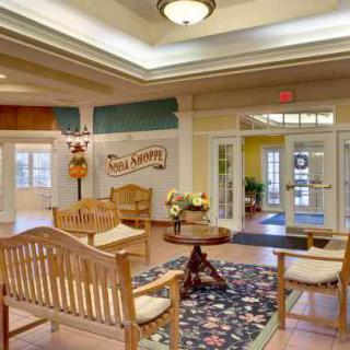 A welcoming lobby with comfortable wooden seating and a stylish decor.