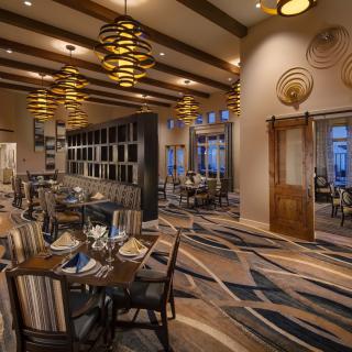 A modern restaurant interior with elegant lighting and stylish seating.