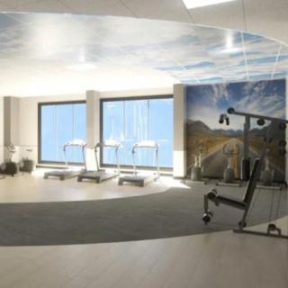 A modern gym interior with treadmills and exercise equipment.