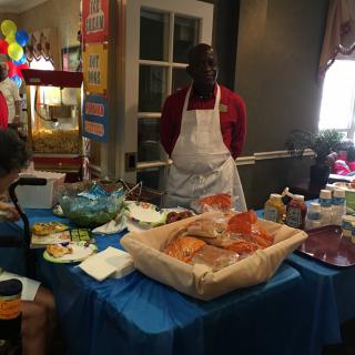 A catering setup with a variety of food displayed on a table.