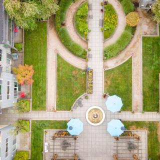 Aerial view of a landscaped courtyard with pathways and greenery.