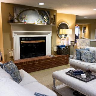 A cozy living room with a fireplace and elegant decor.
