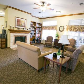 A cozy living room with comfortable seating and a fireplace.
