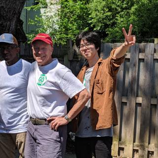 A group of friends enjoying a sunny day outdoors, posing for the camera.