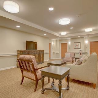 A cozy living room with stylish furniture and modern lighting.