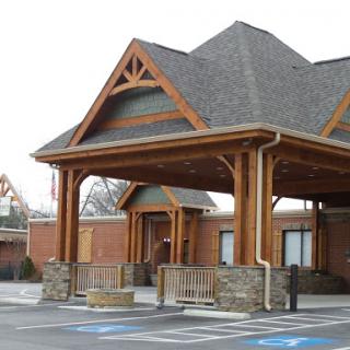A charming lodge-style building showcasing wooden architecture and a welcoming entrance.